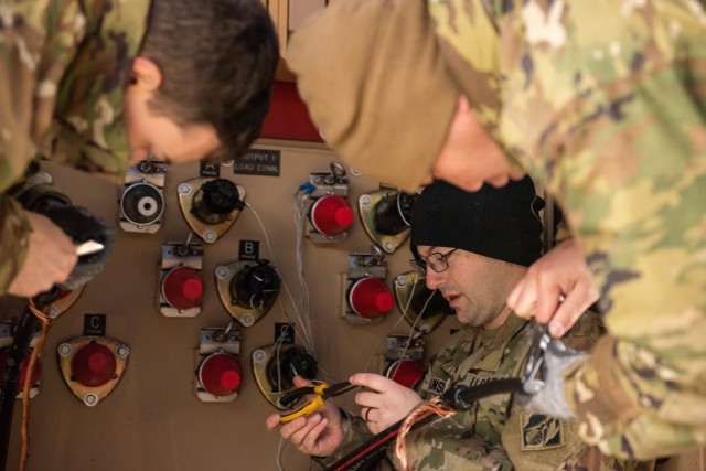 Sgt. Talon Lunsford, a Prime Power Specialist Course student, prepares to terminate a cable during a capstone event in December at the U.S. Army Prime Power School. The event gives students the opportunity to demonstrate all they have learned during the eight-month course. 