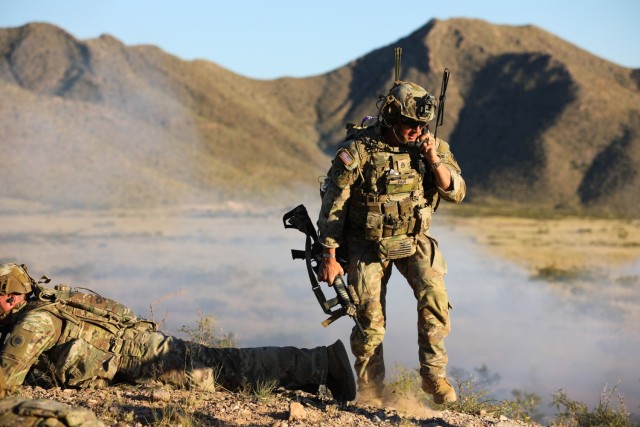 U.S. Army Staff Sgt. Timmy Fair, an infantry squad leader assigned to 1st Battalion, 125th Infantry Regiment, 37th Infantry Brigade Combat Team, operates a radio during a live-fire training exercise near Fort Bliss, Texas, Oct. 31, 2022. Soldiers of the 1-125 IN conducted intense and extensive squad maneuvers during the exercise, using live ammunition to simulate a real-world combat environment, honing their interoperability and lethality. (U.S. Army National Guard photo by Staff Sgt. Scott Fletcher)