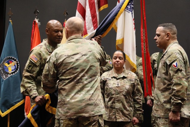 Army Materiel Command Commander Gen. Ed Daly transfers the AMC flag from outgoing Command Sgt. Maj. Alberto Delgado, right, to incoming Command Sgt. Maj. Jimmy Sellers, left, Jan. 12 at Redstone Arsenal. The time honored transfer of colors...