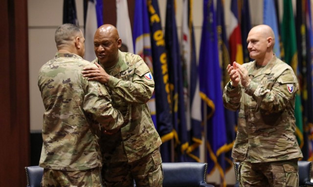 Army Materiel Command’s incoming Command Sgt. Maj. Jimmy Sellers expresses his gratitude to AMC’s outgoing Command Sgt. Maj. Jimmy Sellers during a change of responsibility ceremony Jan. 12. To the right is AMC commander Gen. Ed Daly.