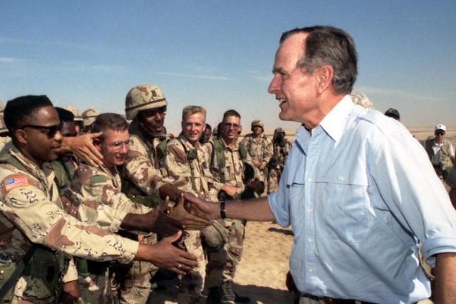 President Bush greets troops in Saudi Arabia during his Thanksgiving visit on Nov. 22, 1990.

