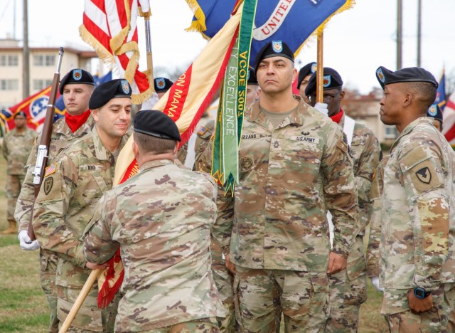 Command Sgt. Maj. David A. Rio, far left, accepts the U.S. Army Garrison Japan guidon from USAG Japan Commander Col. Christopher L. Tomlinson during a change-of-responsibility ceremony Dec. 2, 2022, at Yano Field on Camp Zama, Japan. 