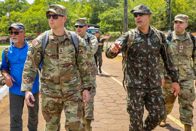 During the initial planning conference for exercise Southern Vanguard 24 in Macapa, Brazil, Dec 5-8, 2022, Master Sgt. Rob Mitchell and a Brazilian army infantry officer discusses training scenarios, logistics and training objectives for the bilateral event scheduled in the fall. Southern Vanguard is a U.S. Southern Command-sponsored, U.S. Army South-conducted exercise at the operational and tactical levels to increase interoperability between U.S. and Western Hemisphere forces. (U.S. Army photo by Maj. Tifani Summers)