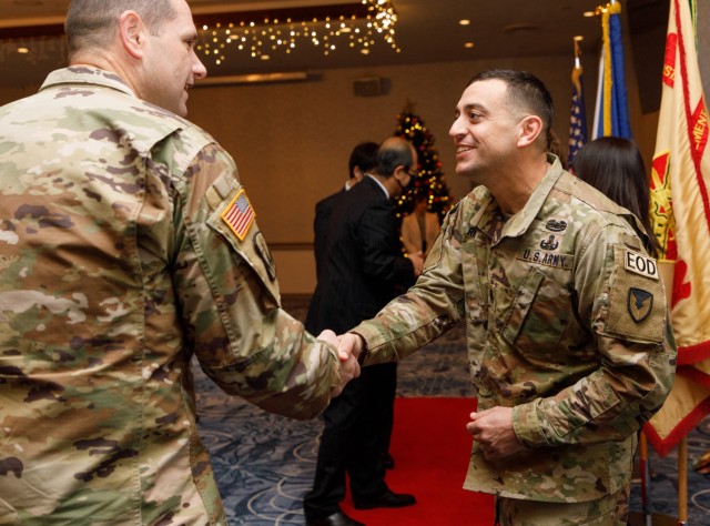 Command Sgt. Maj. David A. Rio, right, shakes hands with attendees during a reception following his change-of-responsibility ceremony at Camp Zama, Japan, Dec. 2, 2022. Rio, senior enlisted leader of U.S. Army Garrison Japan, recently reflected on his time in Japan after about a month in the position. 