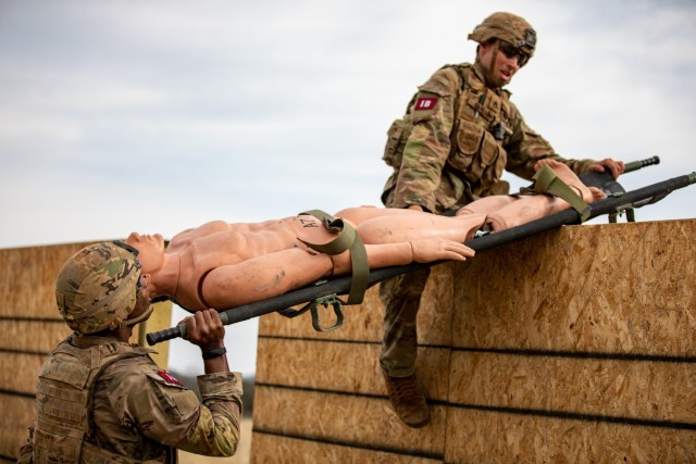Staff Sgt. Abel Carlos and 1st Lt. Calvin Britt, 25th Infantry Division, carry a skid litter during an physical training exercise for the Army&#39;s Best Medic Competition. Twenty-two two-Soldier teams from all around the world traveled to Fort Hood, Texas to compete in the finals to be named the Army’s Best Medic. The competition is a 72-hour arduous test of the teams’ physical and mental skills. Competitors must be agile, adaptive leaders who demonstrate mature judgment while testing collective team skills in areas of physical fitness, tactical marksmanship, leadership, warrior skills, land navigation and overall knowledge of medical, technical and tactical proficiencies through a series of hands-on tasks in a simulated operational environment.