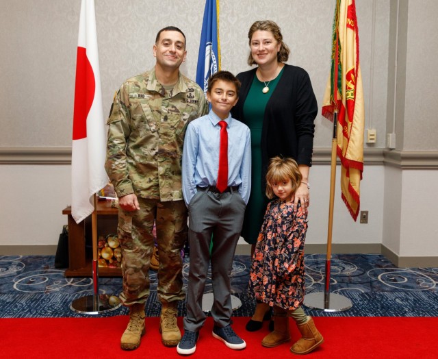 Command Sgt. Maj. David A. Rio and his wife, Joanna, and their two children, Owen and Evelyn, pose for a photograph during a reception following his change-of-responsibility ceremony Dec. 2, 2022, at Camp Zama, Japan. Rio, senior enlisted leader of U.S. Army Garrison Japan, recently reflected on his time in Japan after about a month in the position. 