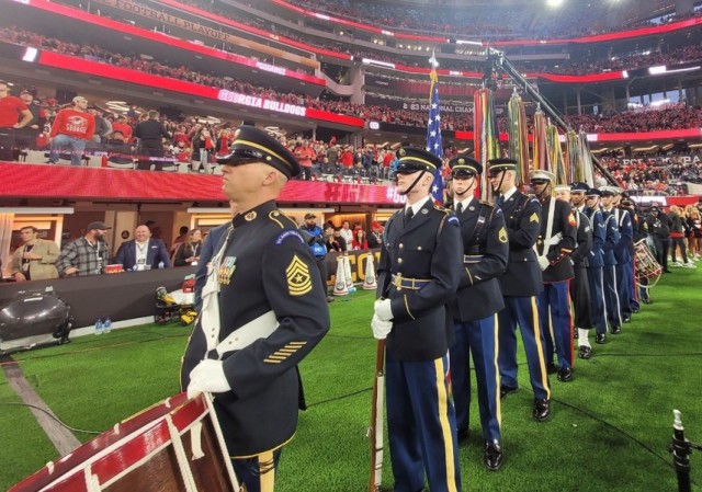 The Joint Armed Forces Color Guard and drummers from The U.S. Army Field Band line up before on sideline prior to colors presentation at the 2023 College Football Playoff National Championship Game on January 9, 2023 at SoFi Stadium in Los Angeles.