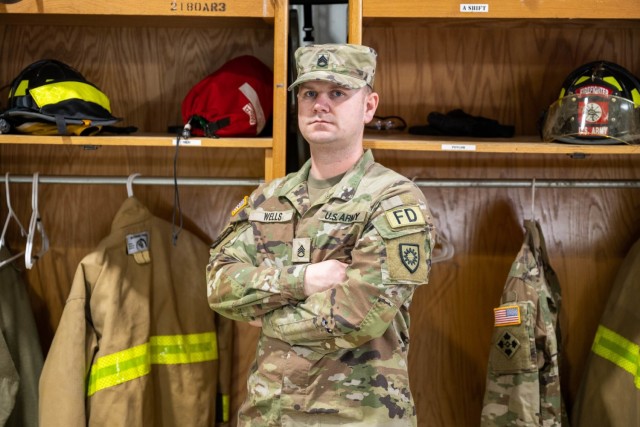 Staff Sgt. Michael Wells stands in the bay of the ASA-Black Sea fire department.