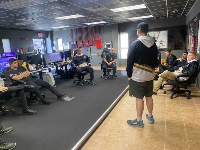 Sgt. Sebastian “Ruszty” Ochoa (left), a 13F fire support specialist, with U.S. Army Esports Team, U.S. Army Recruiting Command sits in on a morning strategy meeting with all the in-house members of the U.S. Army Esports  Team.