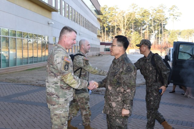 Lt. Gen. Christopher Mohan, Army Materiel Command deputy commanding general and Redstone Arsenal senior commander, shakes hands with Gen. Park Jeong-hwan, chief of staff of the Republic of Korea army, during a visit to AMC headquarters at Redstone Arsenal, Alabama, Jan. 24, 2023.