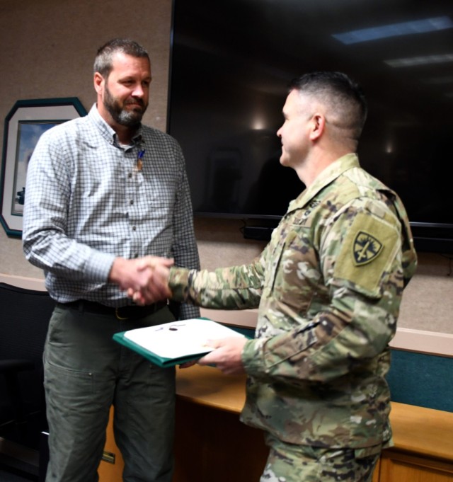 Yuma Test Center Commander Lt. Col. Shane Dering awarded Jonathan Clark a Civilian Service Achievement Medal Jan 18.