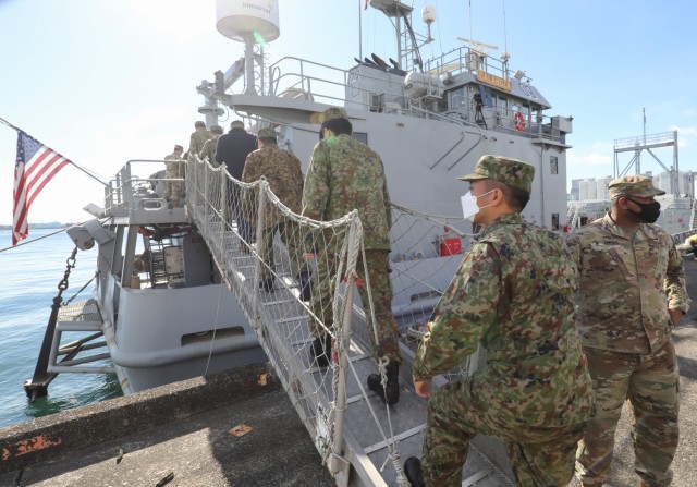 A group of Japan Ground Self-Defense Force leaders tour a U.S. Army landing craft utility vessel at Yokohama North Dock, Japan, Jan. 25, 2023, as part of a familiarization event hosted by the 10th Support Group. 
