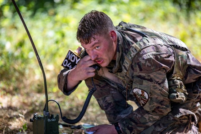 Army Sgt. Tyler Holloway calls in a medical evacuation at the volunteer training site in Milan, Tenn., July 26, 2022. Holloway is with the 115 Field Artillery Brigade in the Wyoming Army National Guard. Fourteen Army National Guard competitors...