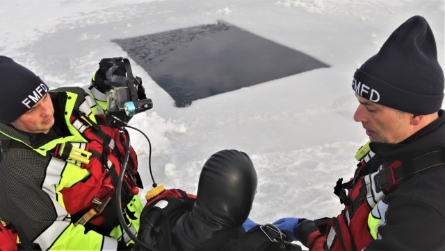 Fort McCoy Fire Department dive team conducts ice rescue training at frozen lake at Fort McCoy