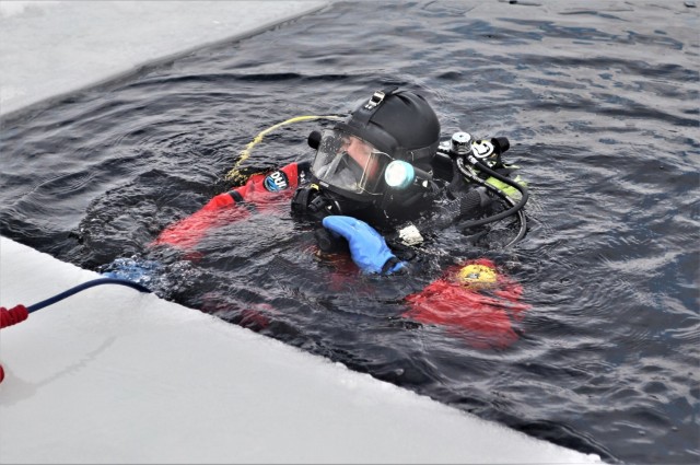 Fort McCoy Fire Department dive team conducts ice rescue training at frozen lake at Fort McCoy