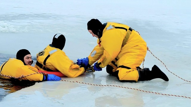 Fort McCoy firefighters train to save people clinging to ice with surface ice rescue training