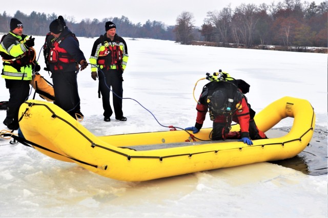 Fort McCoy Fire Department dive team conducts ice rescue training at frozen lake at Fort McCoy