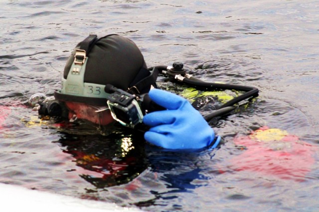 Fort McCoy firefighters hold ice rescue diving training at frozen-over installation lake