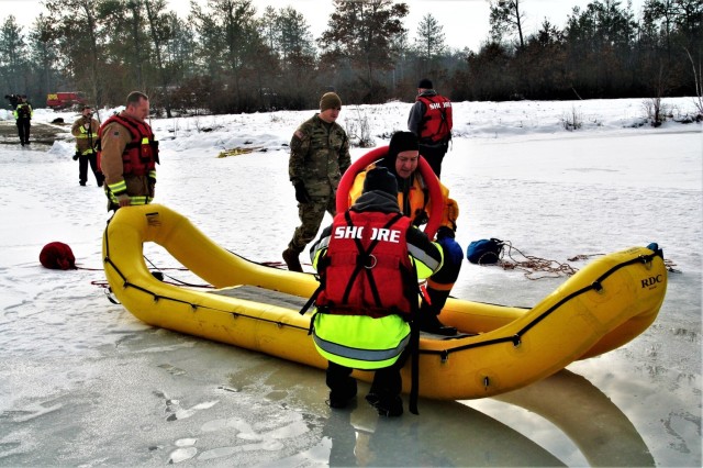 Fort McCoy firefighters train to save people clinging to ice with surface ice rescue training