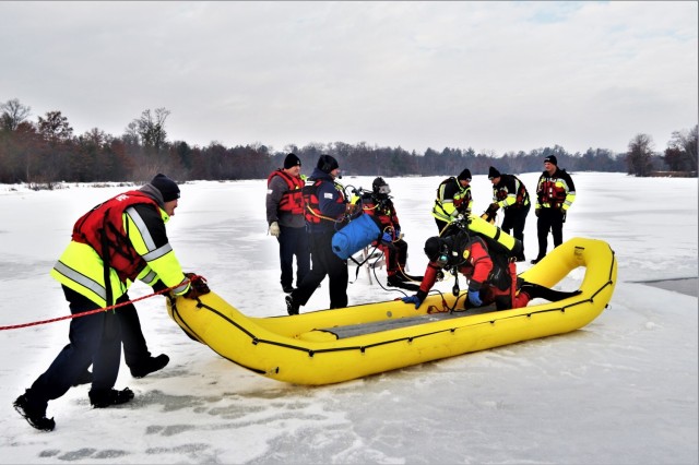 Fort McCoy Fire Department dive team conducts ice rescue training at frozen lake at Fort McCoy
