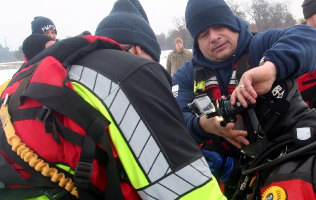 Fort McCoy firefighters hold ice rescue diving training at frozen-over installation lake
