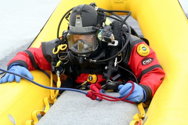 Fort McCoy firefighters hold ice rescue diving training at frozen-over installation lake