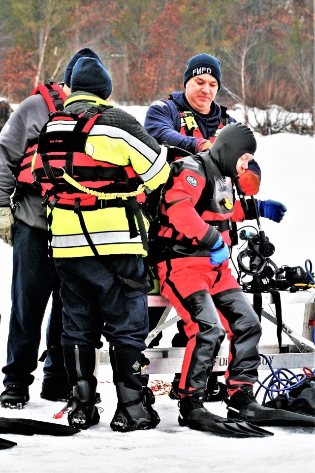 Fort McCoy Fire Department dive team conducts ice rescue training at frozen lake at Fort McCoy