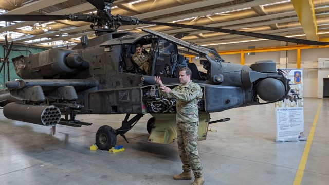 U.S. Army 1st Lt. Sean Schlagel, an aviation officer assigned to Bravo Company, 1st Battalion, 3rd Aviation Regiment (Attack Battalion), 12th Combat Aviation Brigade, gives an overview of the capabilities of the AH-64D Apache Longbow helicopter...
