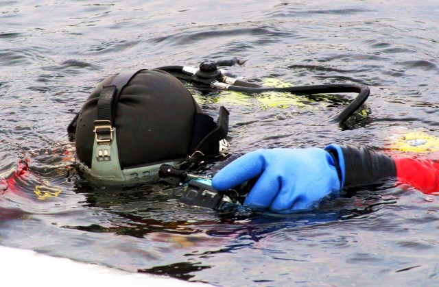 Fort McCoy firefighters hold ice rescue diving training at frozen-over installation lake