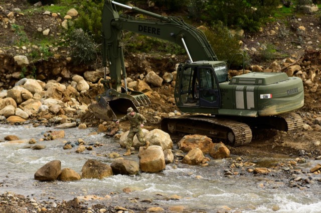 U.S. Army Pfc. Levi Walkup of the California Army National Guard’s 649th Engineer Company, 185th Military Police Battalion, 49th Military Police Brigade, traverses a trail of boulder he placed to shorten the route between his excavator and a mission planning area while working to reroute part of the San Ysidro Creek inside the Randall Road Debris Basin, Jan. 13, 2023, in Montecito, California, as part of the state’s storm response. The basin is in the same area where a deadly mudflow hit in 2018. The engineers are supporting the Santa Barbara County Office of Emergency Management through the California Governor&#39;s Office of Emergency Services. 