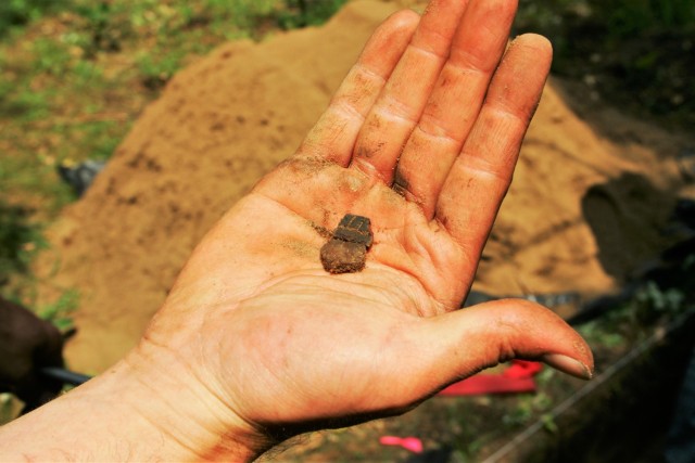 A pottery shard was unearthed July 31, 2014, found in a dig area of the Fort McCoy (Wis.) South Post. A team of archaeologists under contract with Fort McCoy surveys several areas of the post each year for artifacts as part of historical...