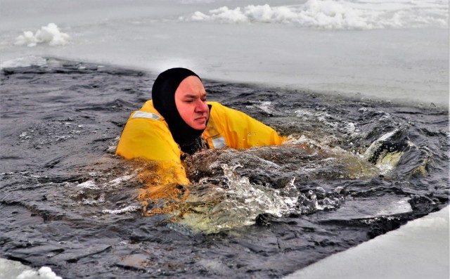 Fort McCoy firefighters train to save people clinging to ice with surface ice rescue training