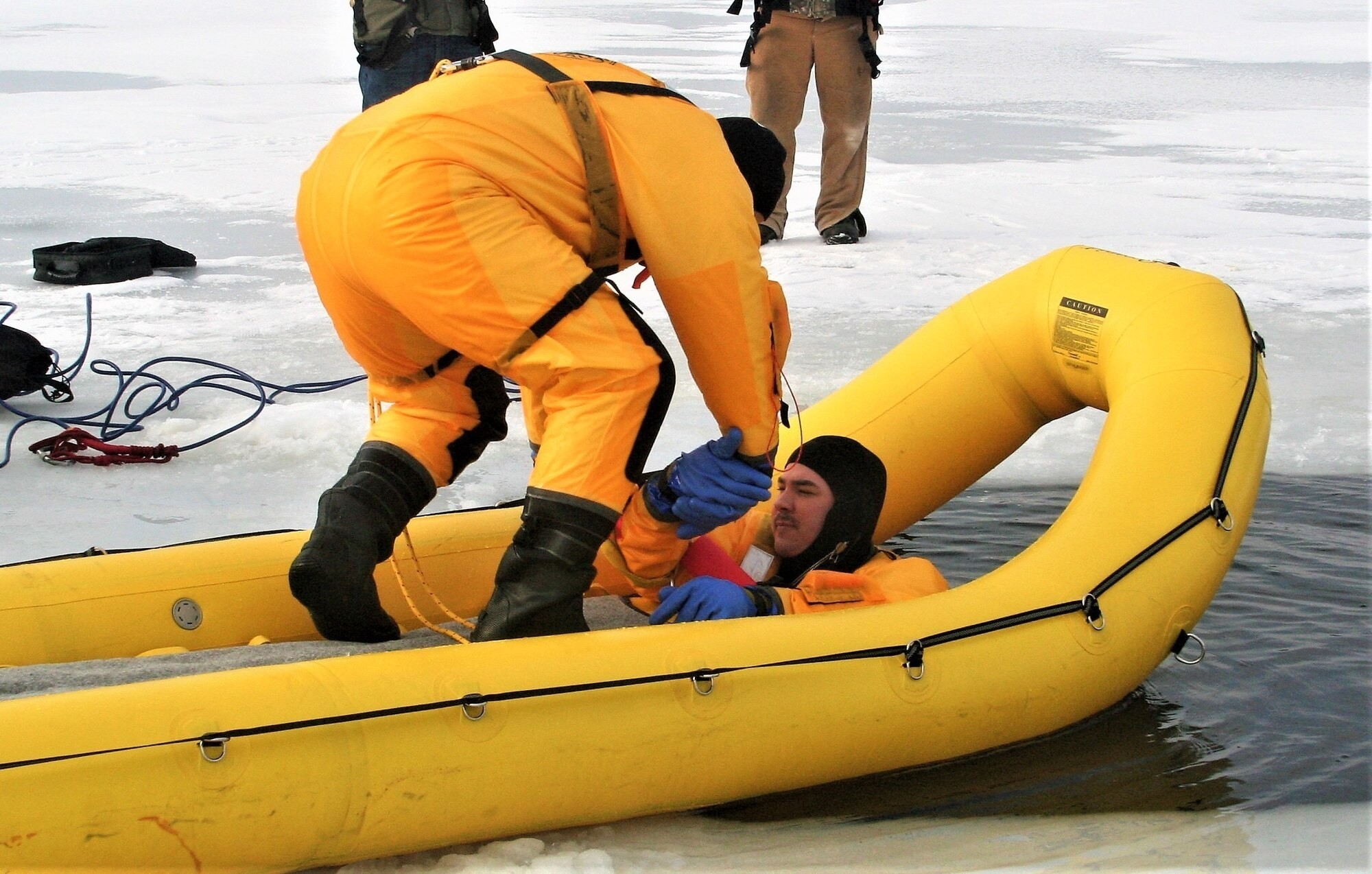 Fort McCoy firefighters train to save people clinging to ice with ...