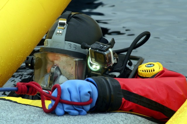 Fort McCoy firefighters hold ice rescue diving training at frozen-over installation lake