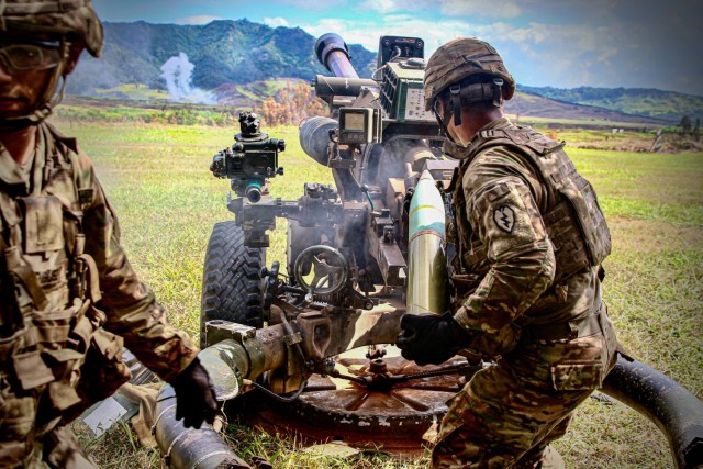 Soldiers with 2nd Battalion, 11th Field Artillery, 25th Infantry Division work with M119 Howitzers.