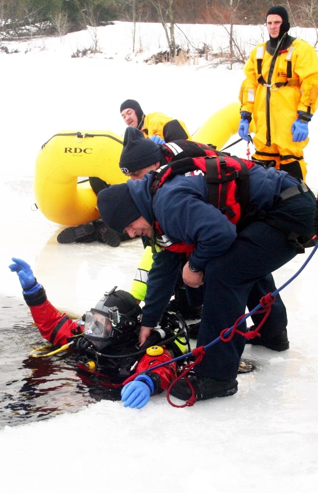 Fort McCoy firefighters hold ice rescue diving training at frozen-over installation lake