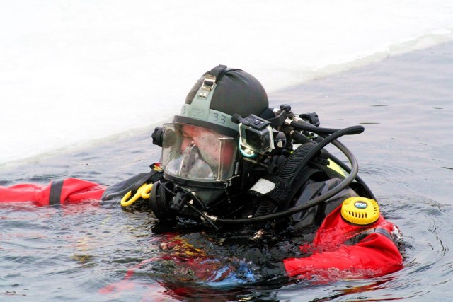 Fort McCoy firefighters hold ice rescue diving training at frozen-over installation lake