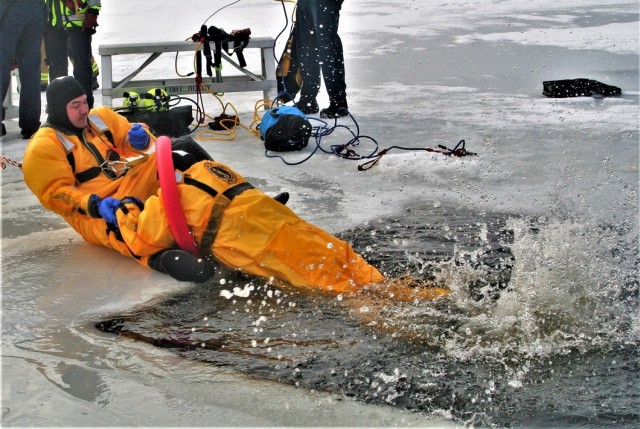 Fort McCoy firefighters train to save people clinging to ice with surface ice rescue training