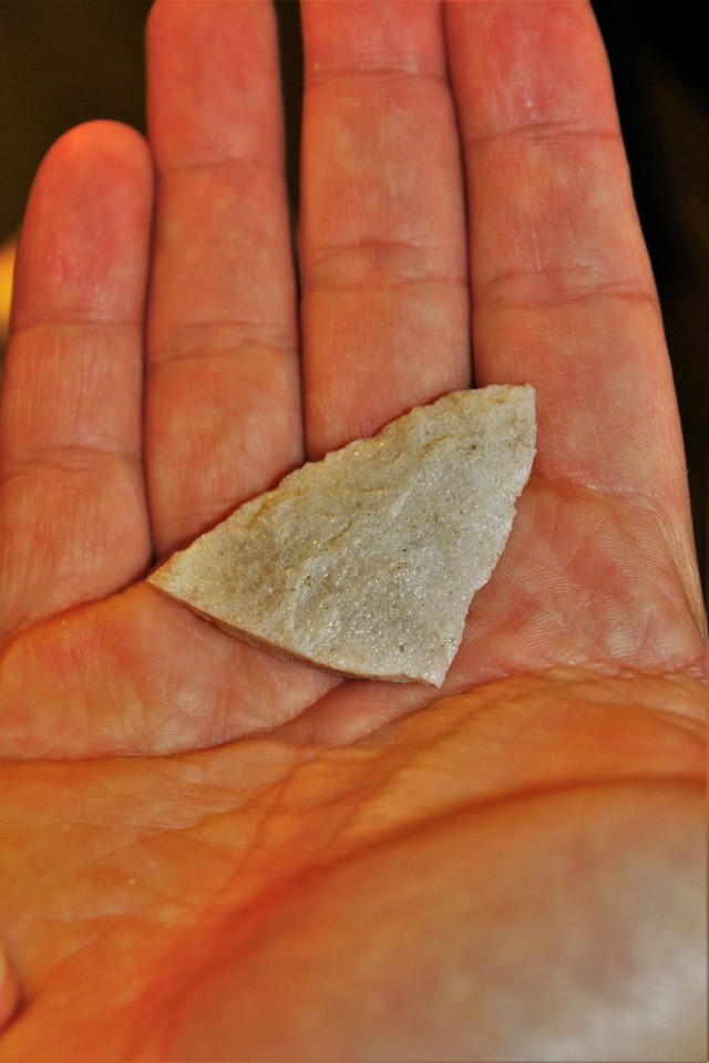 A triangular point that is estimated to be thousands of years old and made by Native Americans is shown Sept. 11, 2017, at an archaeology lab operated by Colorado State University’s Center for Environmental Management of Military Lands under...