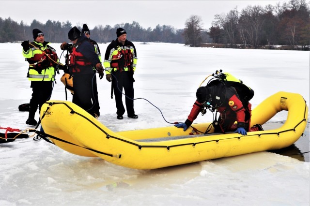 Fort McCoy Fire Department dive team conducts ice rescue training at frozen lake at Fort McCoy