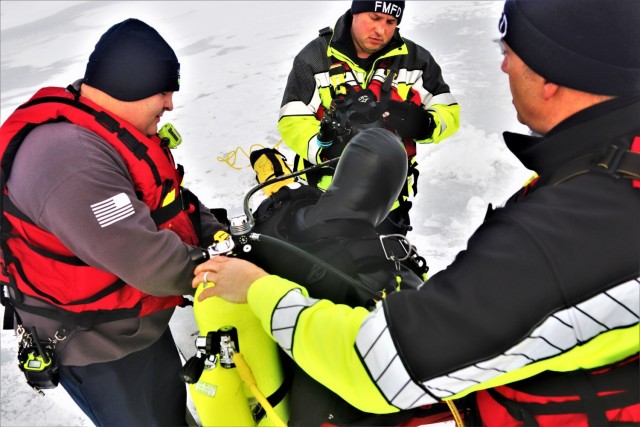 Fort McCoy Fire Department dive team conducts ice rescue training at frozen lake at Fort McCoy
