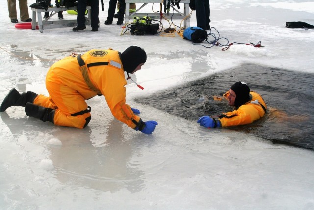 Fort McCoy firefighters train to save people clinging to ice with surface ice rescue training