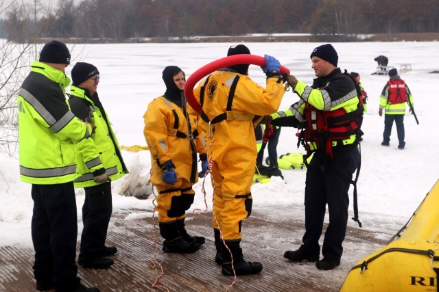 Fort McCoy firefighters hold ice rescue diving training at frozen-over installation lake