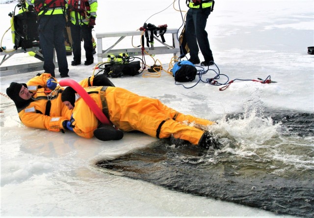 Fort McCoy firefighters train to save people clinging to ice with surface ice rescue training