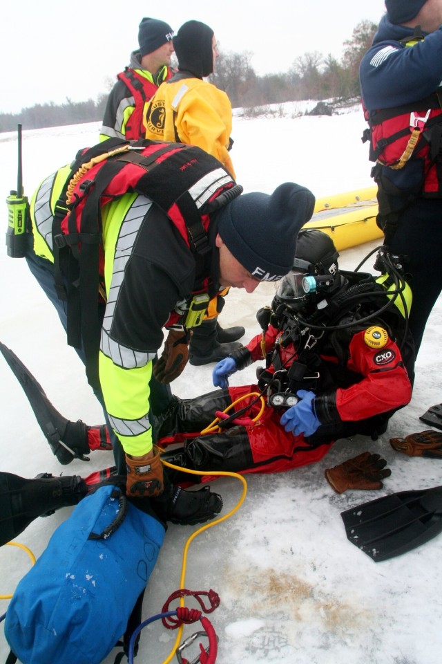 Fort McCoy firefighters hold ice rescue diving training at frozen-over installation lake