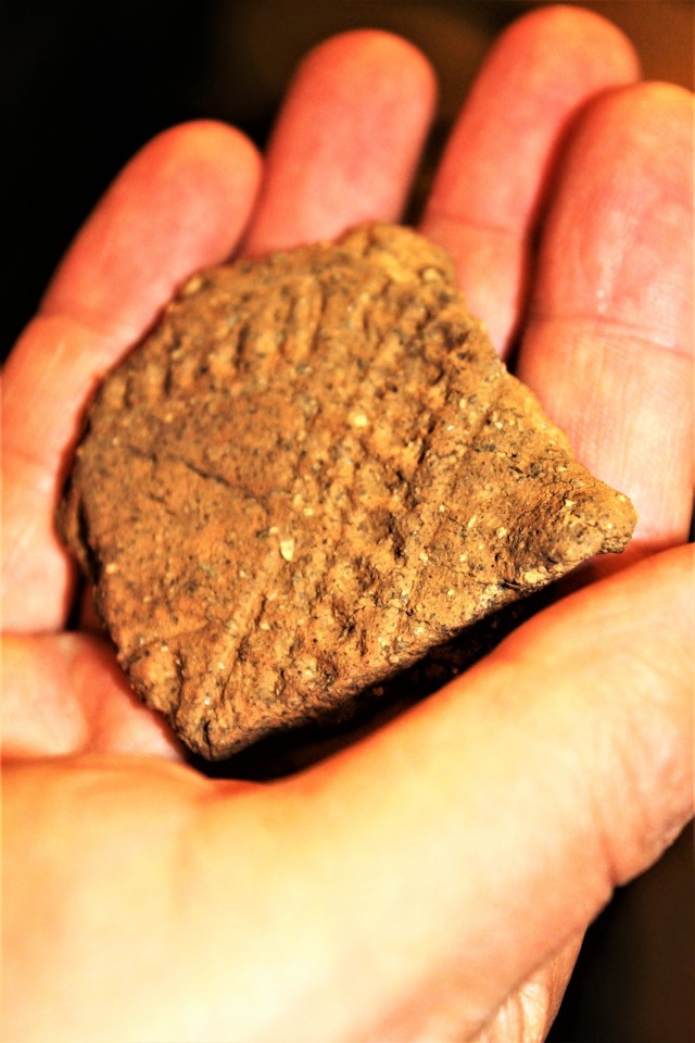 A pottery sherd that is estimated to be thousands of years old and made by Native Americans is shown Sept. 11, 2017, at an archaeology lab operated by Colorado State University’s Center for Environmental Management of Military Lands under...