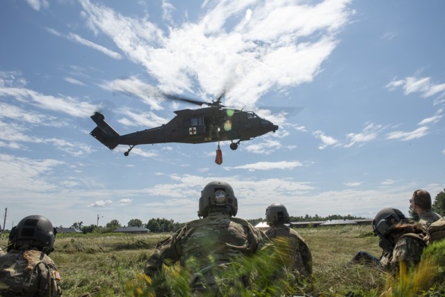 Soldiers with Charlie Company, 3rd Battalion, 126th Aviation Regiment, 86th Troop Command, Garrison Support Command, Vermont National Guard, performed hoist training with Black Hawk helicopters, Camp Johnson, Colchester, Vermont, Aug. 7, 2020. (Photo by U.S. Army National Guard 2nd Lt. Nathan Rivard)