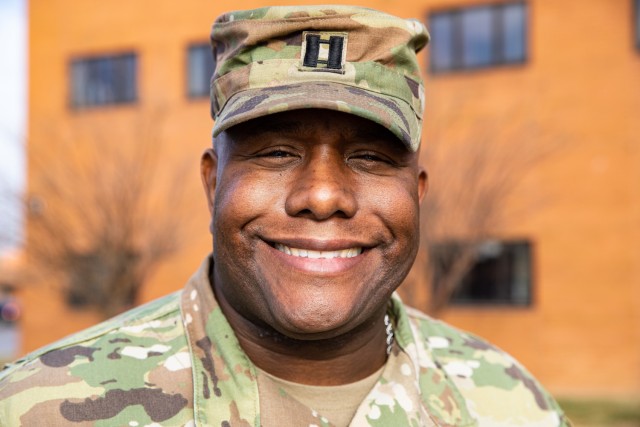Capt. Anthony McClain, the Illinois National Guard director of diversity and inclusion, smiles for a portrait in front of the Illinois National Guard Joint Force Headquarters on Camp Lincoln in Springfield, Ill., Dec. 29, 2022. McClain strives to help the Guard achieve a more inclusive organizational culture. 