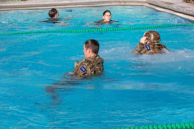 Sgt. Thomas Muhlern, left, and Sgt. Kalton McCallum, both members of the New York Army National Guard&#39;s 2nd Battalion, 108th Infantry, tread water during an event at the Army Best Medic Competiton on January, 22, 2023 at Fort Polk Louisiana....