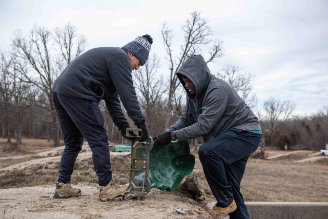 Staff Sgts. Jerome Roberson and Ruben Mendoza with Fort Leonard Wood’s Combat Training Company work to dismantle old target systems Feb.1 at Range 20, making way for new target systems to be installed.
